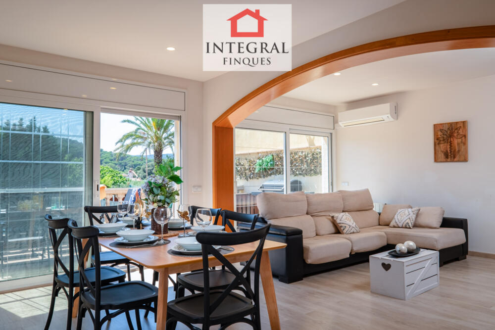 Very spacious and bright dining-living room with large windows.