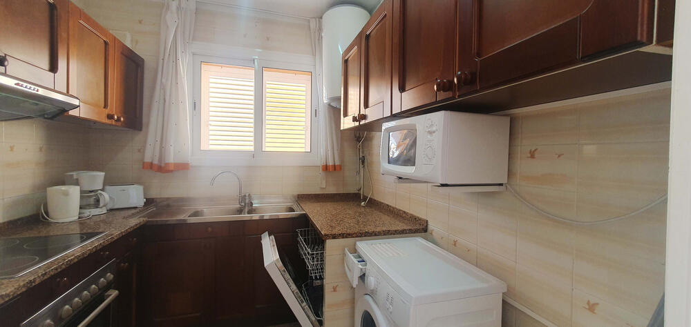 Open kitchen with oven and dishwasher